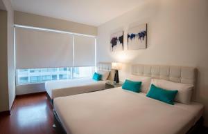 Llit o llits en una habitació de Mariel Hotel Boutique 37 fotos més