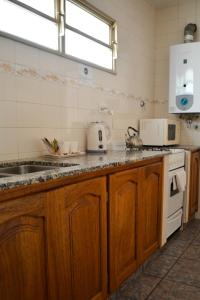 Kuchyň nebo kuchyňský kout v ubytování Argenta Apart Hotel