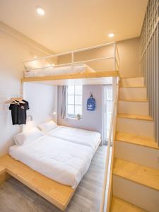 Postel nebo postele na pokoji v ubytování Norn Yaowarat Hotel