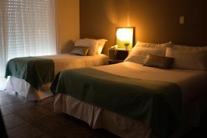 Katil atau katil-katil dalam bilik di Argenta Apart Hotel