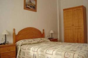Posteľ alebo postele v izbe v ubytovaní Apartamentos Rurales Las Colinas