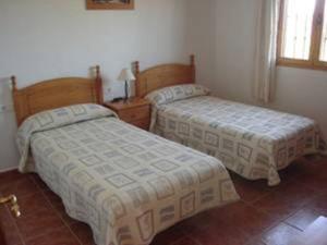 Posteľ alebo postele v izbe v ubytovaní Apartamentos Las Colinas