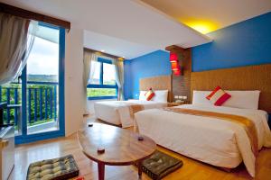 Postel nebo postele na pokoji v ubytování Golden Sea Inn