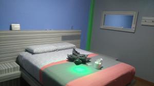 Un pat sau paturi într-o cameră la Hotel H - Eco Adults Only