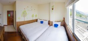 Giường trong phòng chung tại Siangting B&B