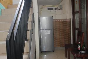 Kuchyň nebo kuchyňský kout v ubytování Putra Dadi Guest House