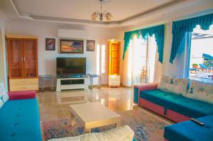 a living room with a couch and a table at Villa Erdo Kalkan 5 Bedroom Villa in Kalkan