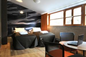 Postel nebo postele na pokoji v ubytování Hotel Kokořín