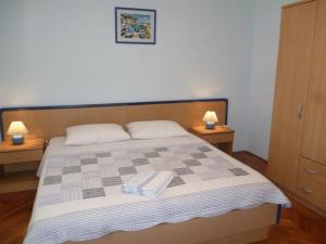 Postel nebo postele na pokoji v ubytování Apartment Marisa