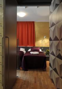 A bed or beds in a room at Hotel Kokořín
