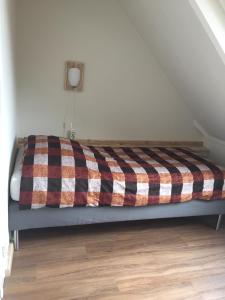 Een bed of bedden in een kamer bij Herberg de Zwaan Hedel