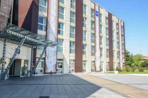 an empty street in front of a building at Idea Hotel Milano Malpensa Airport in Case Nuove