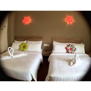 Postel nebo postele na pokoji v ubytování Hotel Flora Plus