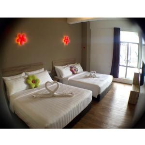 Postel nebo postele na pokoji v ubytování Hotel Flora Plus