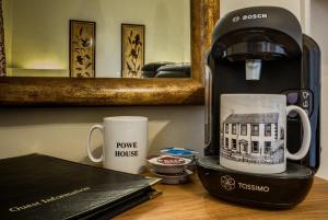 a coffee maker and a coffee mug on a table at Powe House in Keswick
