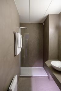 a bathroom with a shower and a sink at Hotel Corsendonk Viane in Turnhout