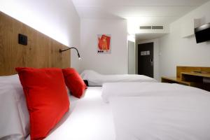 Łóżko lub łóżka w pokoju w obiekcie Hotel Corsendonk Viane