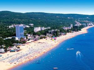 an aerial view of a beach with people and the water at Cathedral Guesthouse in Varna City