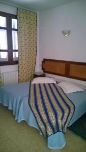 Postel nebo postele na pokoji v ubytování Hotel Excellence