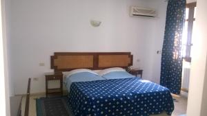 En eller flere senge i et værelse på Hotel Excellence