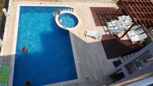 an overhead view of a swimming pool with people in it at Villa Dobre Vode in Dobra Voda