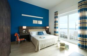 Postel nebo postele na pokoji v ubytování Hotel Giulia + 37 fotografií