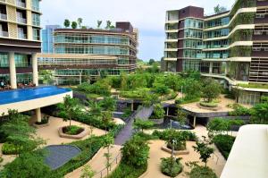 an aerial view of a courtyard with trees and buildings at Holi Afiniti Themed Suites in Nusajaya