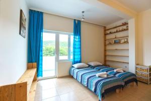 Postel nebo postele na pokoji v ubytování Yoga & Apartment Zlata Oliva