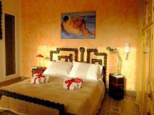 מיטה או מיטות בחדר ב-Incanto delle Ninfe