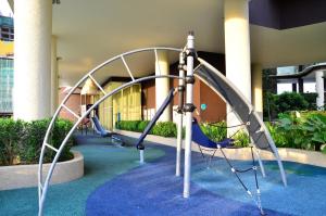 a playground in a building with a slide at Holi Afiniti Themed Suites in Nusajaya