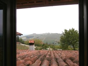 a view from a window of a roof at B&B Rumanot in Dogliani +7 photos