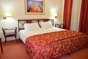 Postel nebo postele na pokoji v ubytování Hotel Galaxias