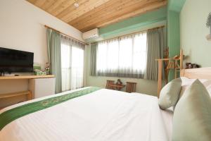 Voodi või voodid majutusasutuse Shang Shui Yun Ji B&B toas