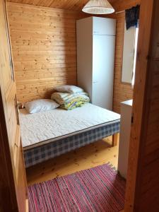 Llit o llits en una habitació de Hannunluhdan Lomamökit