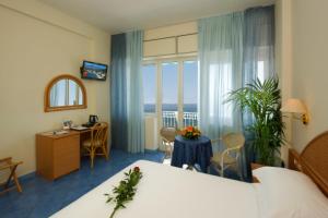 Łóżko lub łóżka w pokoju w obiekcie Hotel Pensione Reale