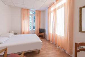 Postel nebo postele na pokoji v ubytování City Résidence Termalia