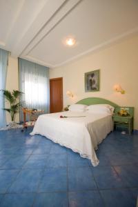 Łóżko lub łóżka w pokoju w obiekcie Hotel Pensione Reale
