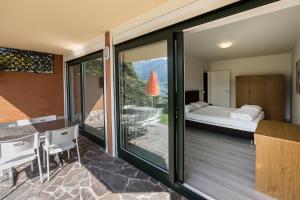 Posteľ alebo postele v izbe v ubytovaní Residence Parco Lago di Garda + 37 fotografií