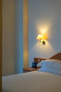 Łóżko lub łóżka w pokoju w obiekcie Hotel Pensione Reale