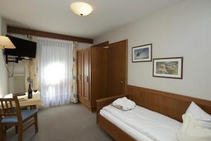 Postel nebo postele na pokoji v ubytování Landhotel Post