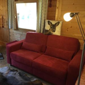 Ein Sitzbereich in der Unterkunft Romantic Wooden Lodge,Sauna,Schwimmteich,alleinstehend,absolut ruhig