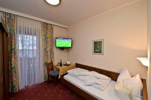 Postel nebo postele na pokoji v ubytování Landhotel Post
