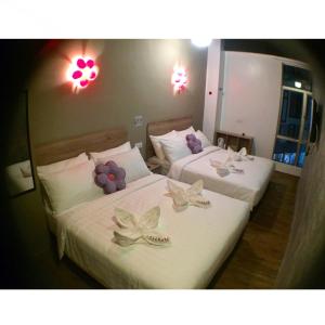 Postel nebo postele na pokoji v ubytování Hotel Flora Plus