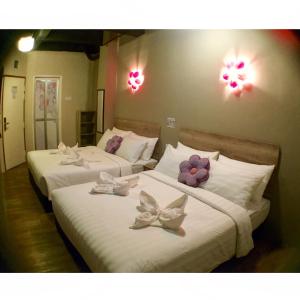 Postel nebo postele na pokoji v ubytování Hotel Flora Plus