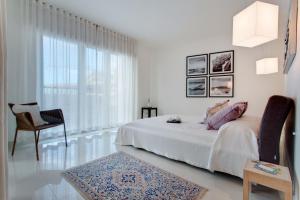 Ein Bett oder Betten in einem Zimmer der Unterkunft Marvellous Apartment in Tigne Point