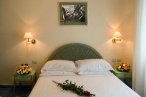 Łóżko lub łóżka w pokoju w obiekcie Hotel Pensione Reale