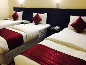 Postelja oz. postelje v sobi nastanitve Simba Hotel