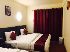 Postelja oz. postelje v sobi nastanitve Simba Hotel