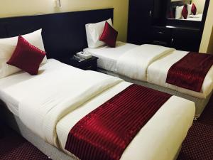 Postelja oz. postelje v sobi nastanitve Simba Hotel