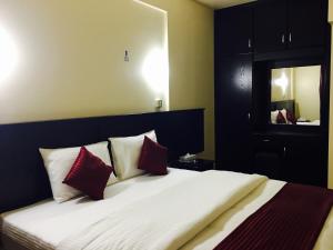 Postelja oz. postelje v sobi nastanitve Simba Hotel